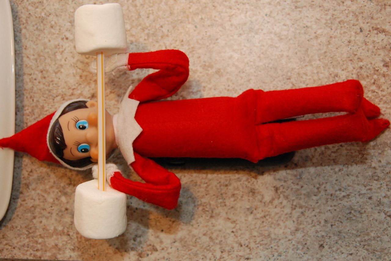 30 fun and unique Elf on the Shelf Ideas - Elf On the Shelf Lifting Weights